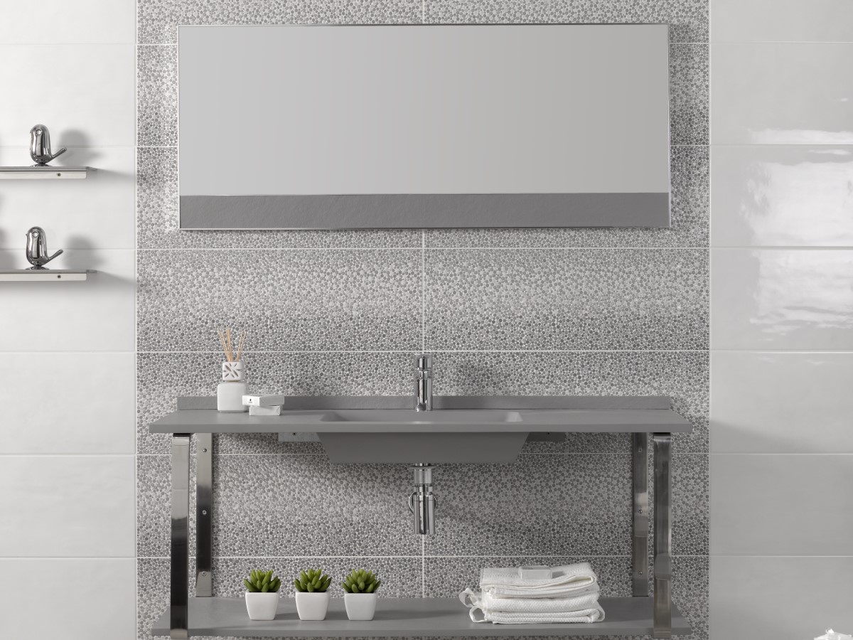 up to date bathroom with a think minimalist basin and unique grey decor tile
