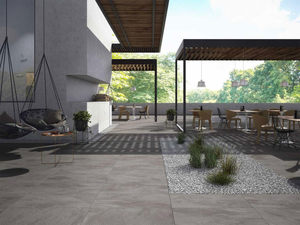 outside dinning & lounge area with a feature garden