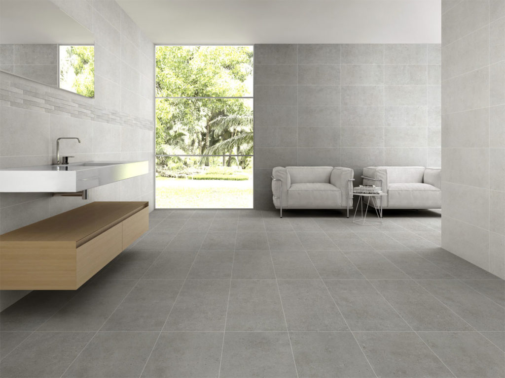 designer washroom with a large window and grey wall and floor tiles