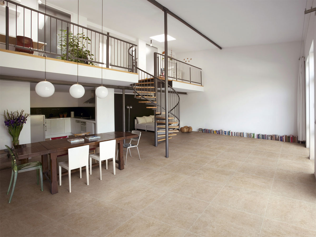 designer kitchen area with a spiral stair case to an upper level