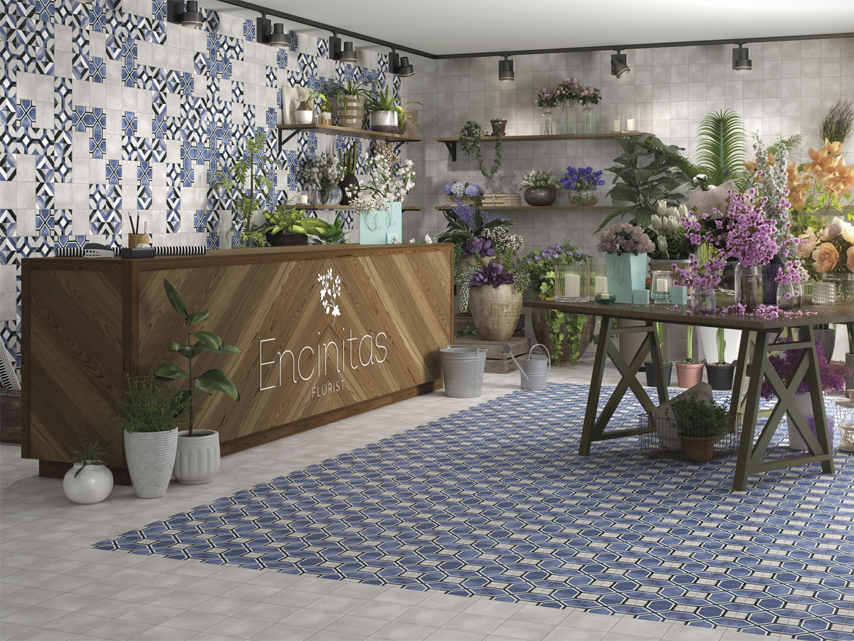 A stylishly designed florist shop with patterned tiles in the wall and floor