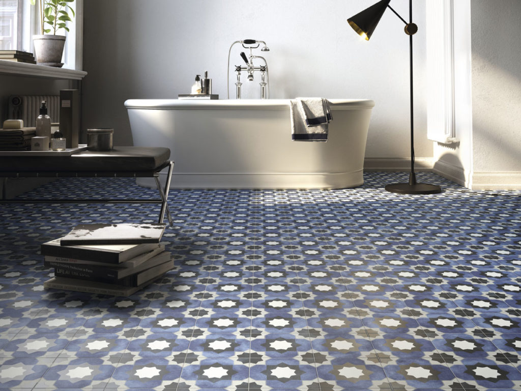 modern freestanding bath on a patterned tile floor