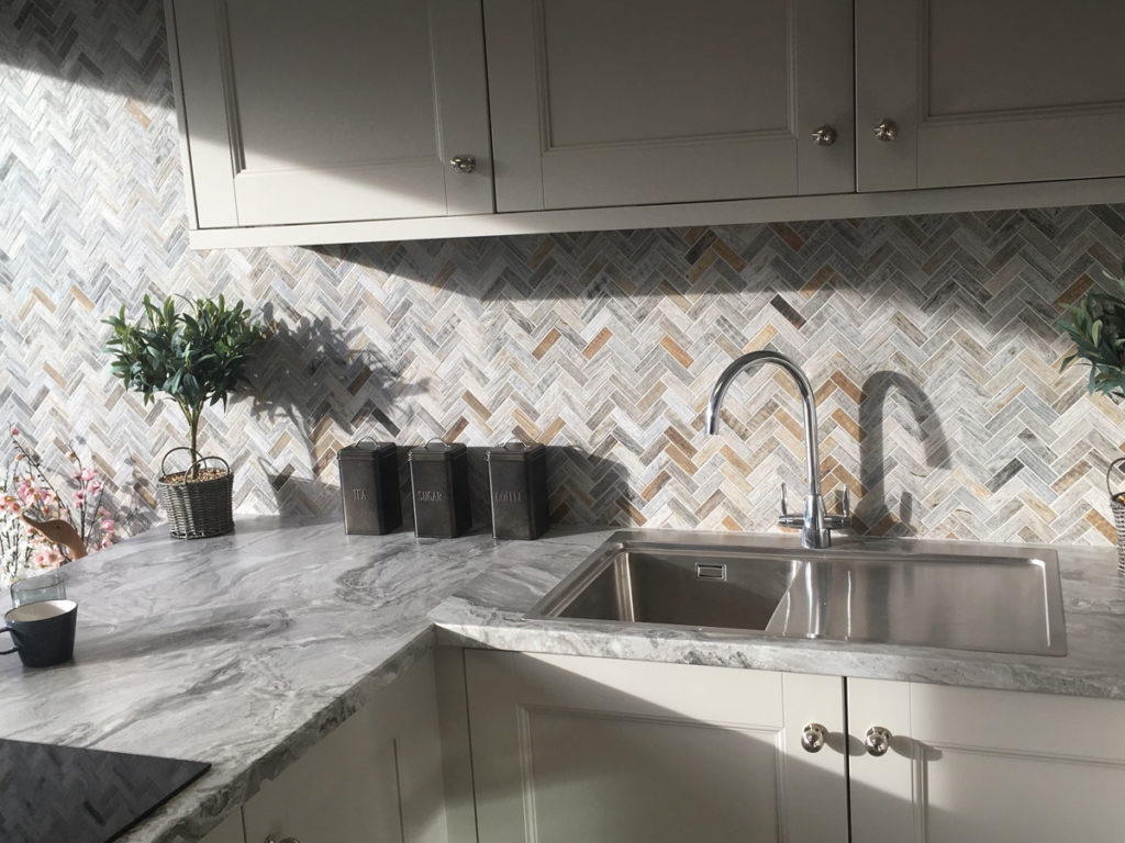 stylish kitchen with herringbone wood effect splash back