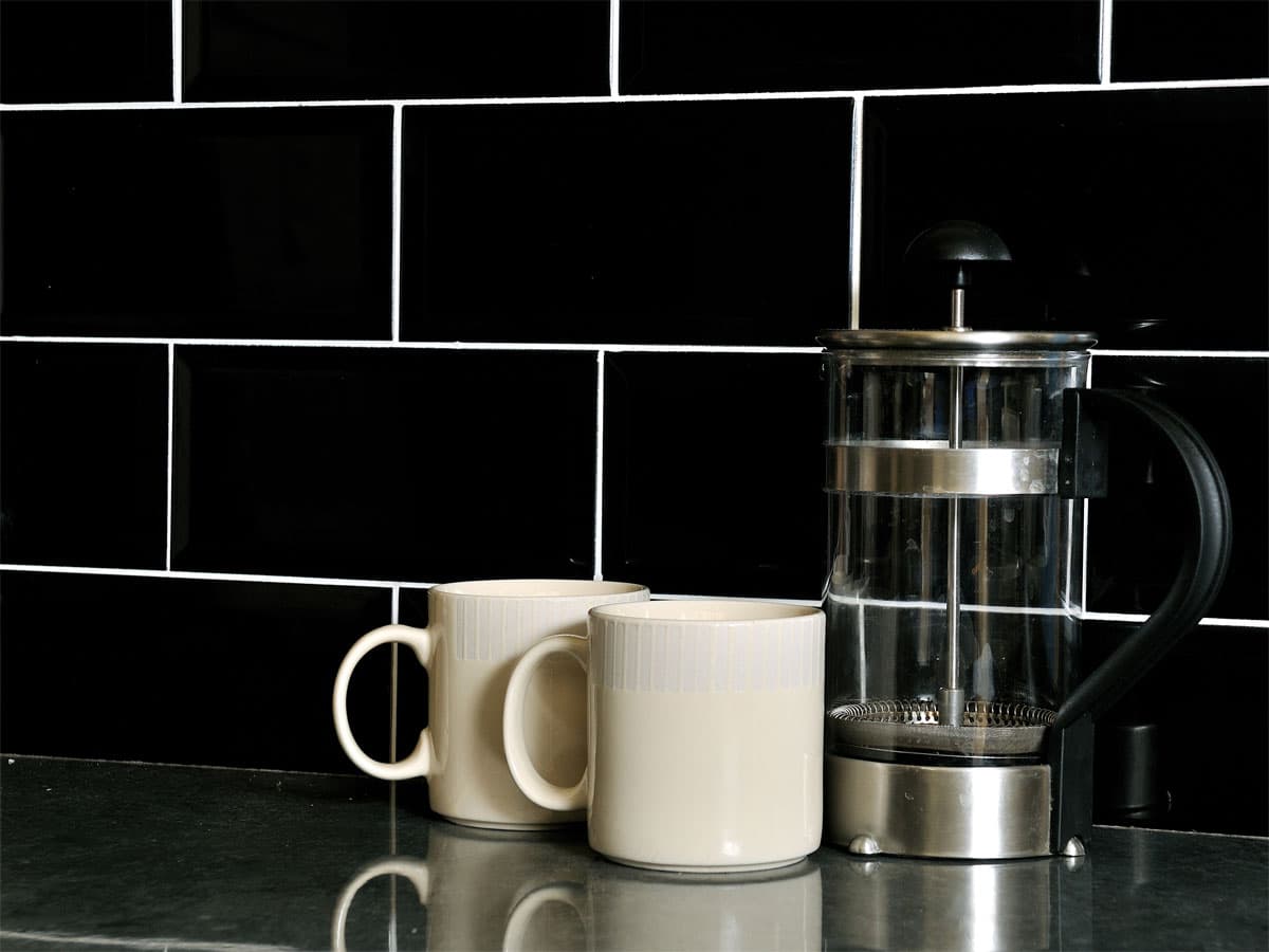 kitchen splashback with a cafetiere and two cups