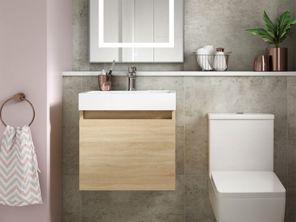 light wood effect unit with a square toilet and grey stone effect tiles
