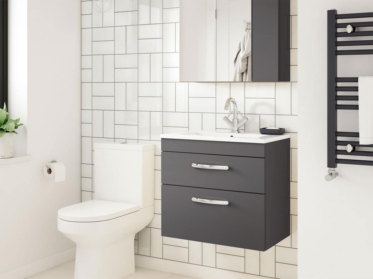 modern anthracite drawer unit with basin and a metro tiled wall