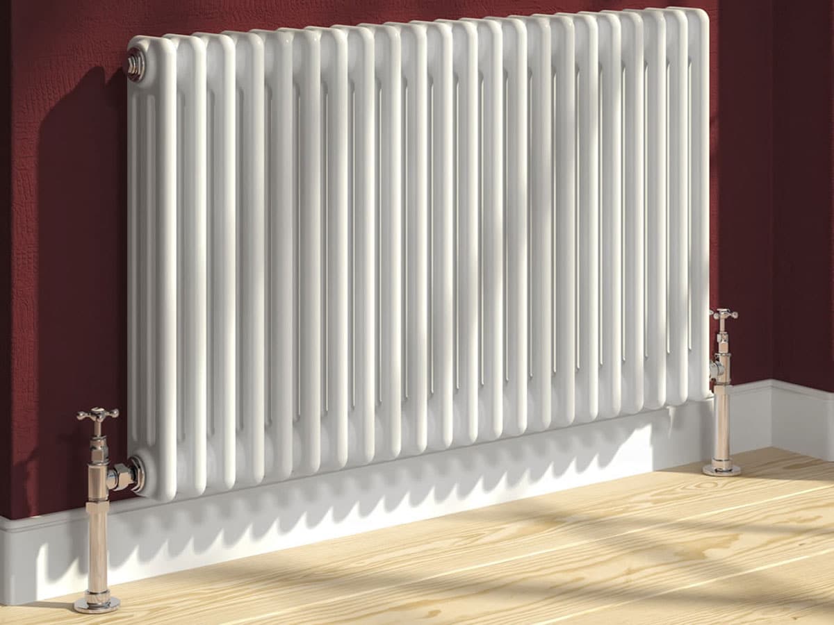 traditional, white radiator with cross head valves