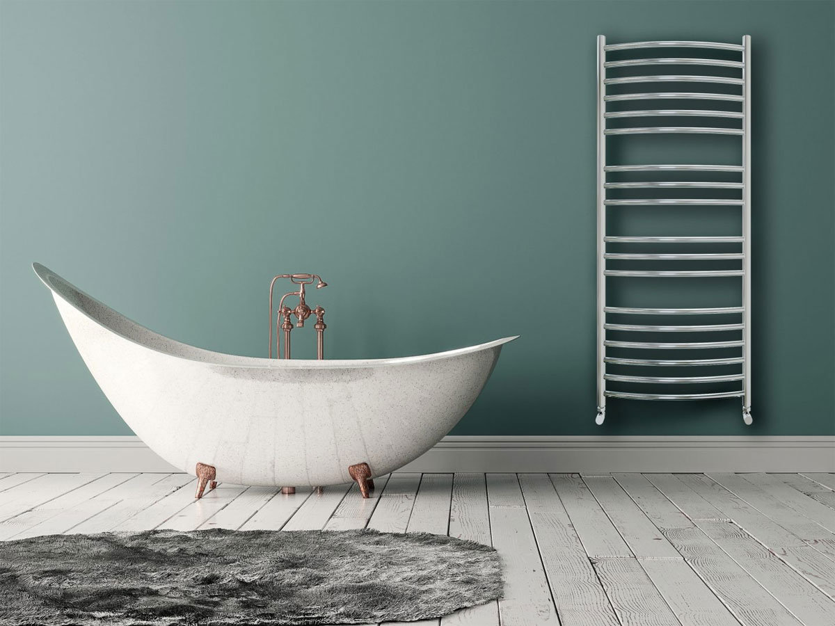 unique freestanding bath with copper feet and taps and a stainless steel radiator