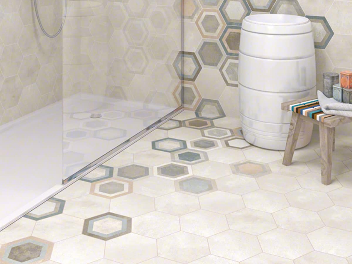 mixture of patterned and plain hexagon wall tiles in a modern shower room setting