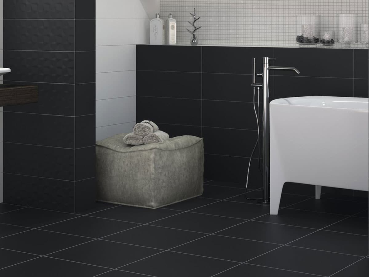 black bathroom tiles on both the wall and floor in a satin finish