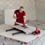 Image showing the rubi rs manual cutter being used to cut tiles