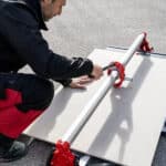 Image showing the rubi rs manual cutter being used to cut tiles