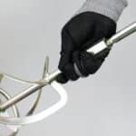 Electric handheld mixer for grout, adhesive, cement and other building materials
