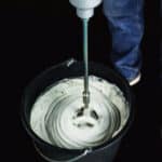 Electric handheld mixer for grout, adhesive, cement and other building materials